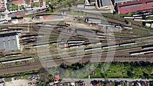 Aerial 4k drone view of old locomotive train depot, parking iron horses on railway routes