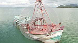 aerial 4K footage of Thai fishing boat sunken ship wreck