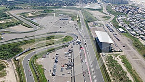 Aerial 4k video of motor sport race track at village of Zandvoort in the Netherlands