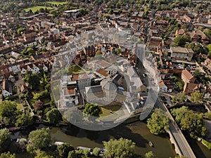 Aerial of Abingdon townscape on a sunny day with trees and buildings around