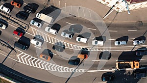 Aerial above view of many stucked cars in a traffic jam.