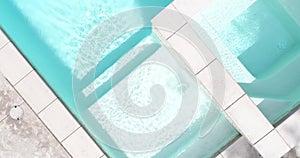 Aerial abstract of waterfall and steps of swimming pool