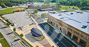 Aerial ACD Automobile Museum entrance with parking lots on bright sunny day