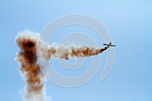 Aerial acrobatics plane in the cloud of smoke