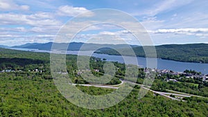 Aerial Adirondack Upstate New York Lake Placid Lush Green Trees Over Lake Town Day