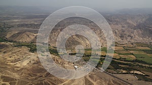 Aerial airplane panoramic view to Nazca plateau with geoglyph lines , Ica, Peru photo