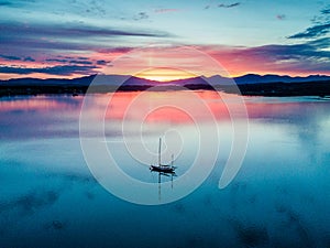 Aerial of an amazing sunset with sailing vessel Loch Creran, Barcaldine, Argyll