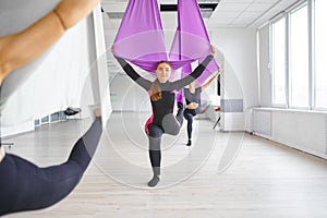 Aerial or antigravity yoga, training on hammocks