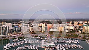 Aerial approach Downtown Sarasota Florida marina and highrise towers business district