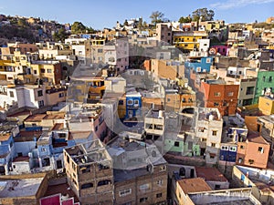 Aerial Approach Vibrant Colorful Latin American Hill Village of Guanajuato Mexico at Foot of Mountain.