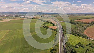 Aerial ascent over autobahn in countryside
