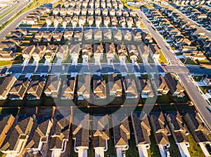 Aerial Austin Suburb rows of Houses sunrise across round rock texas