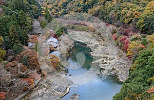 Aerial autumn color view of Asashiyama mountain and Hozugawa river in Kyoto, Japan