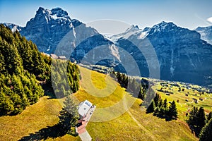 Aerial autumn view of Grindelwald village valley from cableway. Wetterhorn and Wellhorn mountains, located west of Innertkirchen i