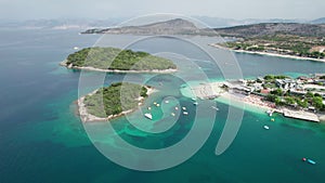 Aerial, Azure Beach with Empty Sun Loungers and Boats, Balkan Sea Coast, Albania