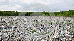 Aerial back big dump filled of plastic garbage which is not processed