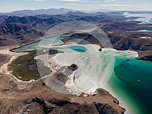 Aerial of Balandra bay surrounded by grey sand dunes photo