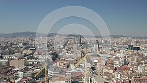 AERIAL: Barcelona Wide Drone Shot of City Towards Center with La Sagrada Familia and Torre Glories, Torre Agbar