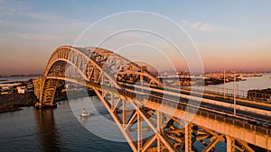 Aerial of Bayonne Steel Arch Bridge + Manhattan - Kill Van Kull - Bayonne, New Jersey and Staten Island, New York City, New York