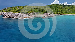 Aerial beach reveal footage on tropical coast at Anse Forbans. Mahe Island, Seychelles