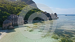 Aerial beach reveal footage on tropical coast at Anse Forbans. Mahe Island, Seychelles