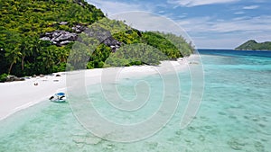 Aerial beach reveal footage on tropical coast at Anse Forbans. Mahe Island, Seychelles