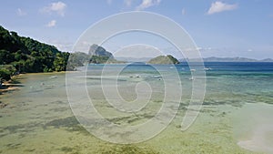 Aerial beach reveal footage on tropical coast at Anse Forbans. Mahe Island, Seychelles