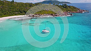 Aerial beach reveal footage on tropical coast at Anse Forbans. Mahe Island, Seychelles