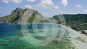 Aerial beach reveal footage on tropical coast at Anse Forbans. Mahe Island, Seychelles