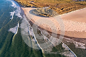 Aerial of the Beautiful Blue Flag Beach, Killahoey Strand near Dunfanaghy, Donegal, Ireland photo
