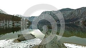 Aerial: Beautiful Mountain Lake In Bohinj, Slovenia At Winter