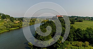 Aerial beautiful view landscape of city and river and church on a small hill.