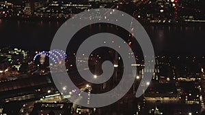 AERIAL: Beautiful Wide Shot over Cologne Germany at Night time with City lights