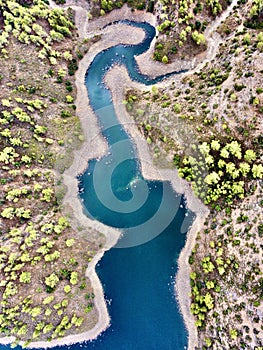 Aerial bird's eye drone view of water Lefkara reservoir river lake Cyprus