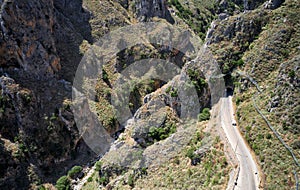 Aerial bird\'s-eye view from drone on Topolia Gorge canyon and road tunnel