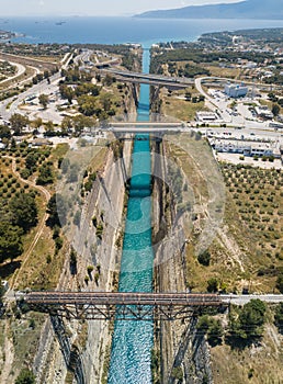 Aerial bird`s eye view photo taken by drone of famous Corinth Canal with turquoise water, Peloponnese, Greece. The