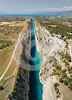 Aerial bird`s eye view photo taken by drone of famous Corinth Canal with turquoise water, Peloponnese, Greece. The