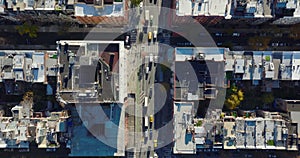 Aerial birds eye overhead top down panning view of busy street in urban neighbourhood. Manhattan, New York City, USA