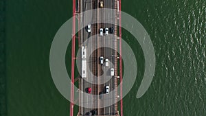 Aerial birds eye overhead top down view of heavy traffic on multilane road in rush hour. Highway bridge over rippled