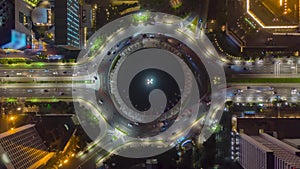 Aerial Birds Eye Overhead Top Down View hyperlapse of busy car traffic on roundabout around Selamat Datang monument in