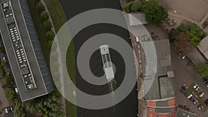 AERIAL: Birds Eye Overhead View Following a Boat on River