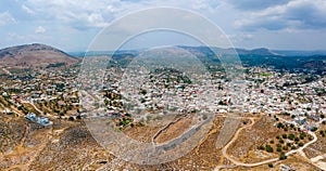 Aerial birds eye view drone photo ancient Archangelos scenic old town with castle on Rhodes island, Dodecanese, Greece. Beautiful