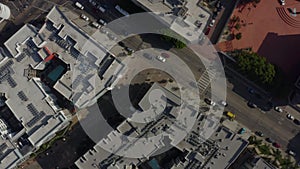 AERIAL: Birds Eye View over Streets of Downtown Los Angeles, california with cars,Traffic and rooftops,Pools, Daylight