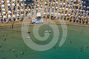 Aerial birds eye view photo taken by drone of iconic beaches in village of Lindos, Rhodes island, Dodecanese, Greece.