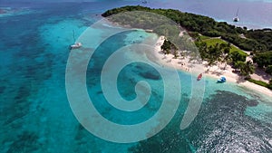 Aerial birds eye view photo taken by drone of tropical seascape and sandy beach with turquoise clear waters