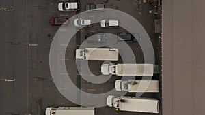 AERIAL: Birdseye View of Cargo Truck loading area with crates and containers
