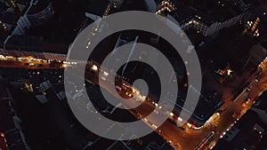 AERIAL: Birdsview of Berlin, Germany street at night with traffic city lights