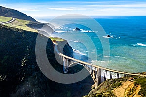 Aerial Bixby Bridge Rocky Creek Bridge and Pacific Coast Highway near Big Sur in California, USA. Drone Shot