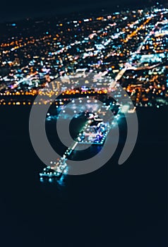 Aerial blurred view of the Santa Monica shoreline at night