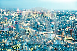 Aerial bokeh of Tokyo skyline from above after sunset on blue hour